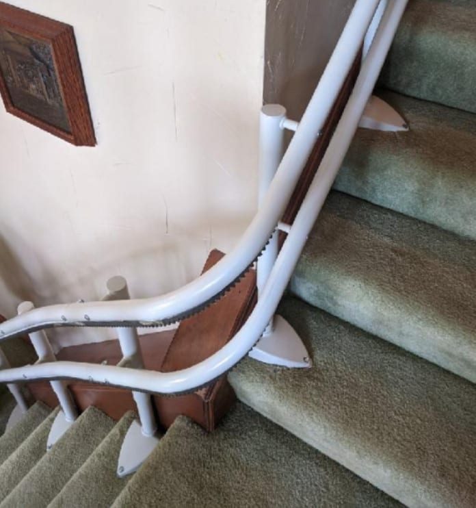 Handicare 2000 stairlift rail curved around a landing
